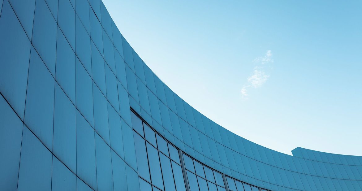 corporate-building-blue-sky-background-with-isolated-place-text corporate-building-blue-sky-background-with-isolated-place-text